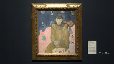 Portrayed figure in ornate golden frame, seated against a colorful background with various symbols and a plaque nearby.